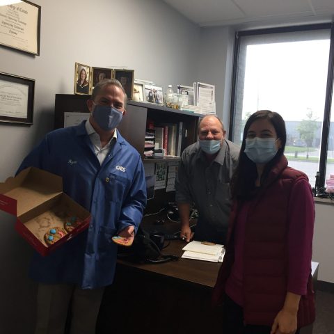 employees in an office with masks