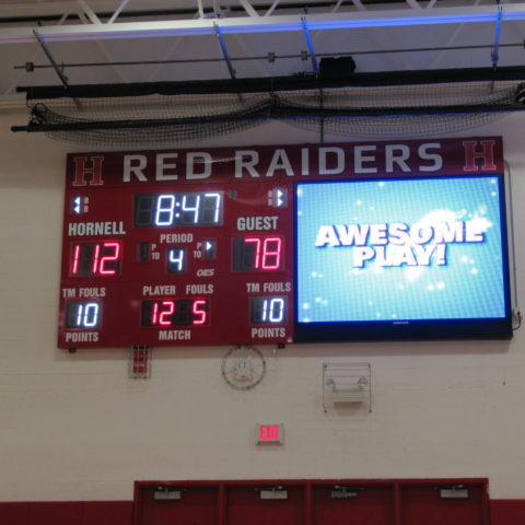 video and scoreboard side by side in a basketball gym