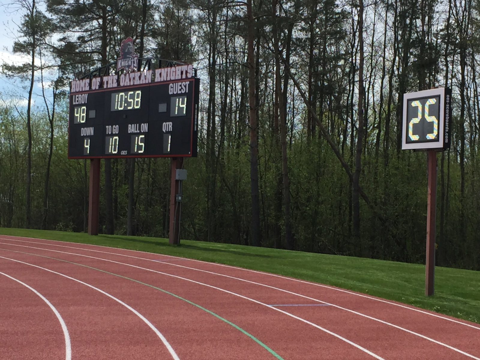 Track with scoreboard in background.