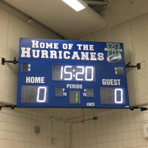 scoreboard in a small gym at a middle school