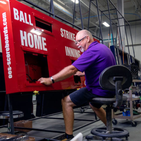 man making scoreboard