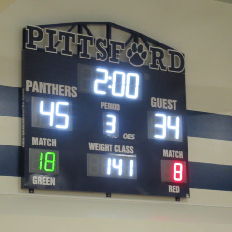 scoreboard showing results of a wrestling match