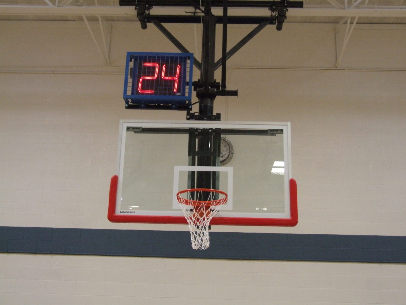 A shot clock above the basketball net.