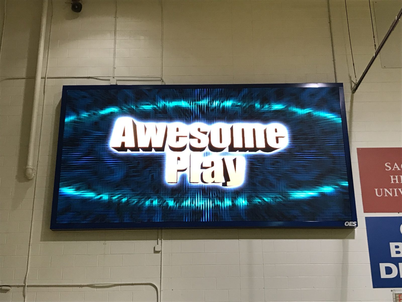 A new indoor LED scoreboard displaying the words Awesome Play.