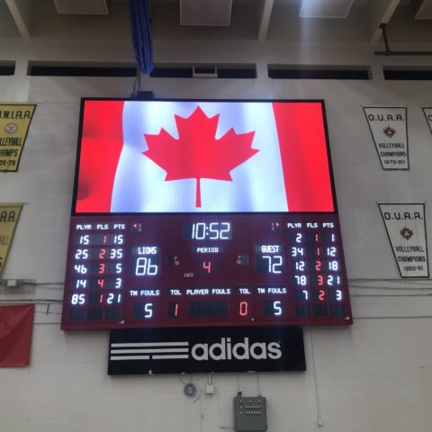 An Indoor scoreboard basketball scoreboard with an LED screen in above.