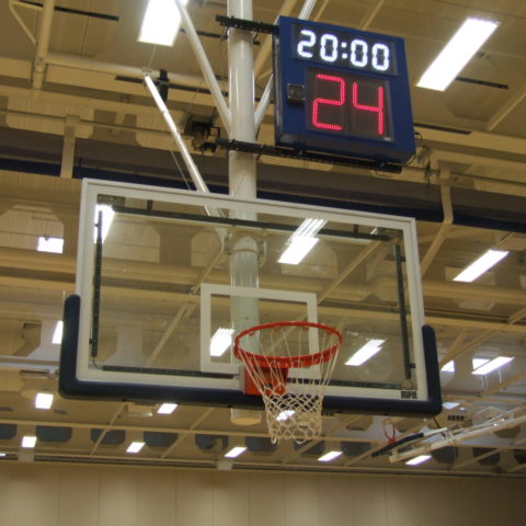 shot clock above a basketball net in a gym