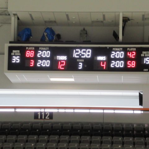 Ice hockey scoreboard under seating box