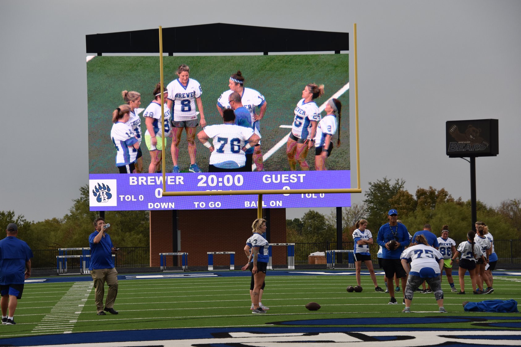 Showing female football players on a video scoreboard