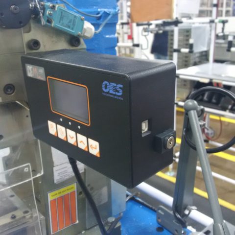 A crimp force monitor attached to a machine