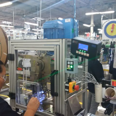 man working on a machine in a factory