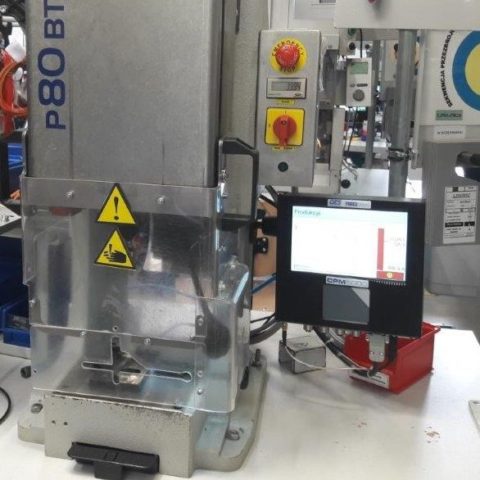 a monitor on a machine in a factory