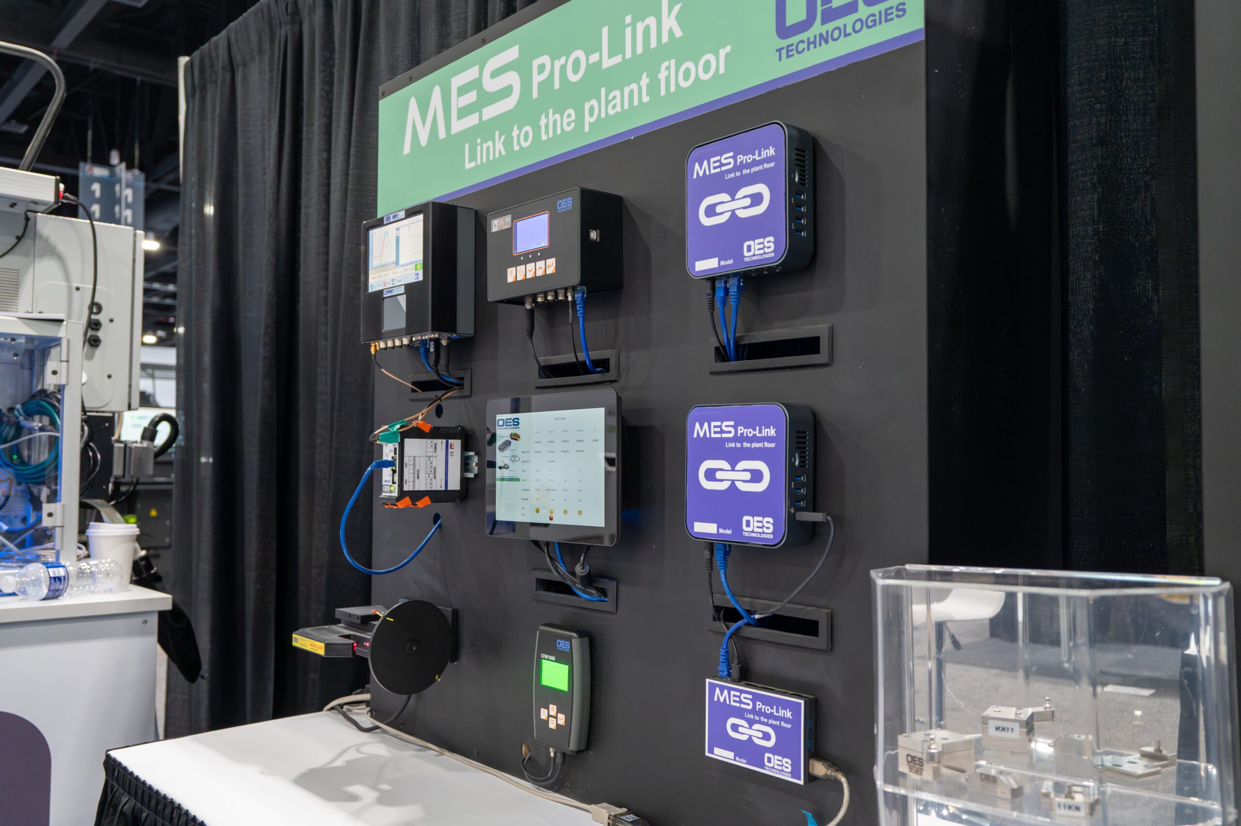 MES (Manufacturing Execution System) is mounted to a black board for display